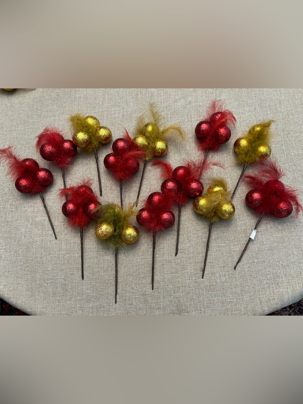 13 glitter ball feather pics red and gold. 7” long.